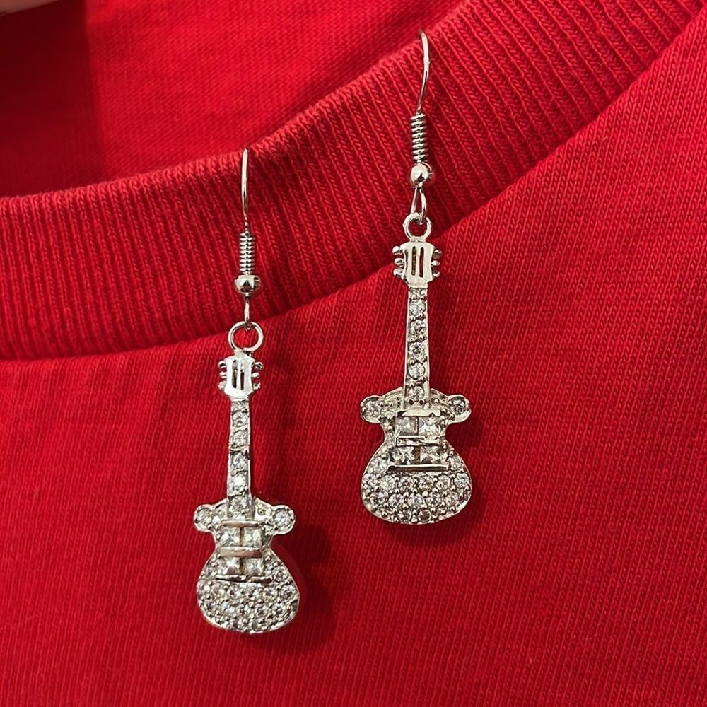 Guitar earrings studded with rhinestones